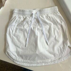 Halara High Waisted Drawstring Side Pocket Curved Hem Mini Golf Skirt - Small